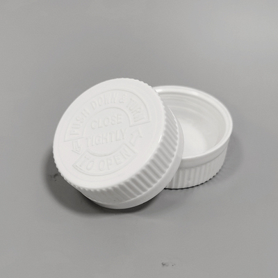 CHILD RESISTANT PUSH DOWN AND TURN CLOSURE: WHITE RIB SIDE / TEXT TOP PP SECURX PUSH-AND-TURN CHILD RESISTANT CAP (CRC)