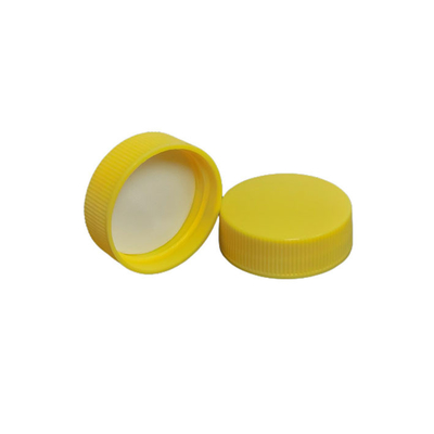 24/410 38-400 Ribbed Yellow Polypro Caps w/ Pressure Sensitive Liners
