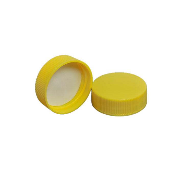 24/410 38-400 Ribbed Yellow Polypro Caps w/ Pressure Sensitive Liners